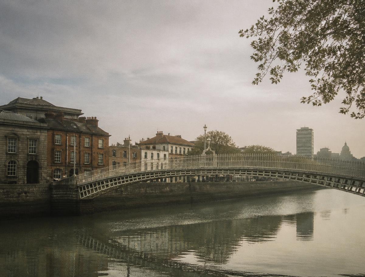 The Ha'penny Bridge over the River Liffey in soft morning light